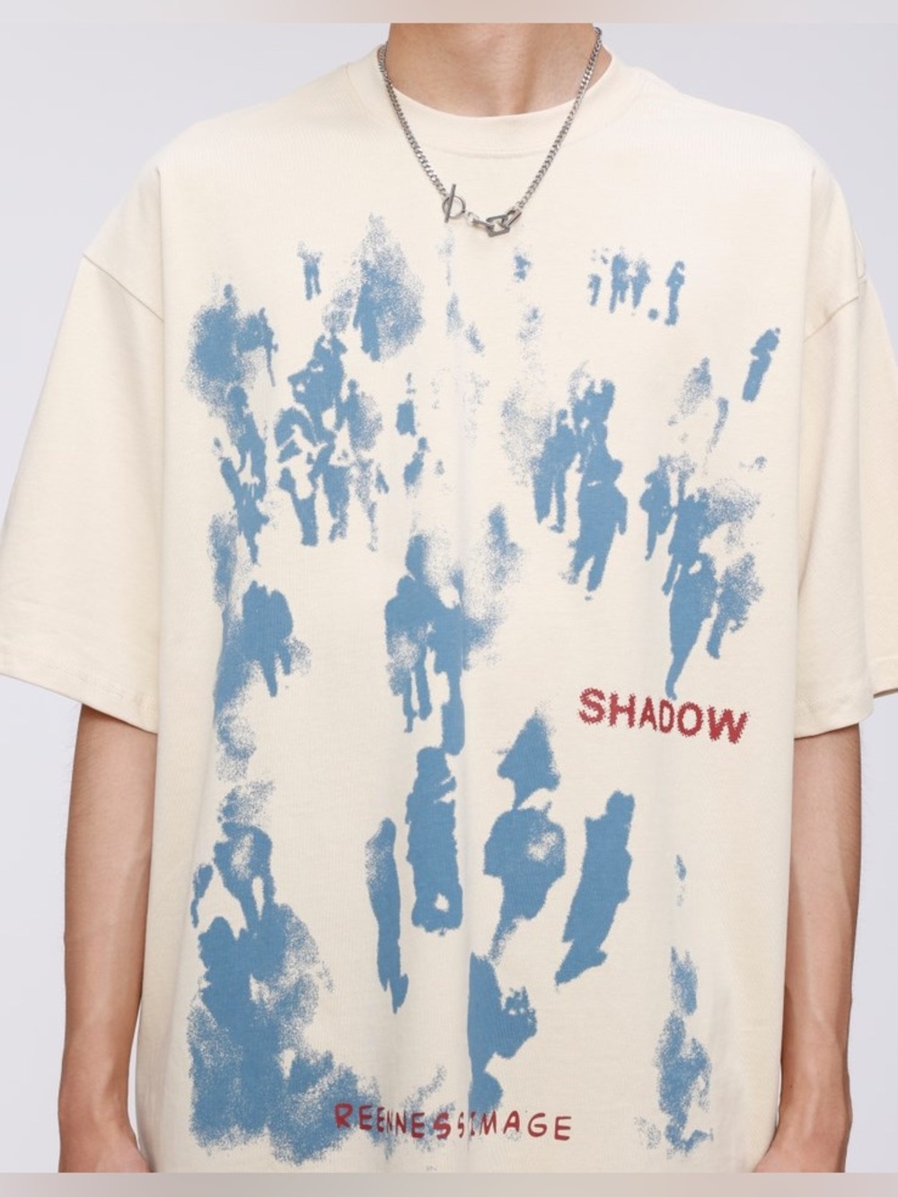 Aelfric Eden Cream Short-Sleeve Shirt with Blue Graphic and Red Text